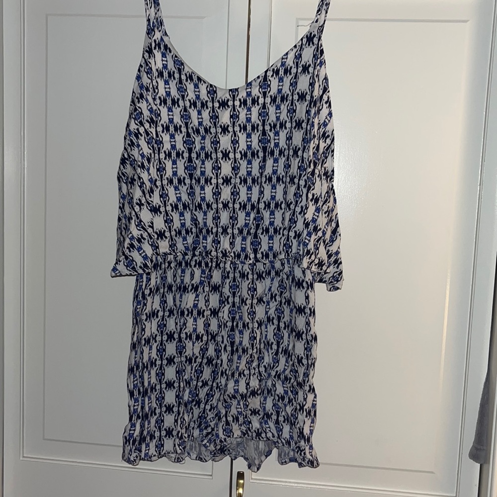 Blue and white patterned romper with pockets, size small